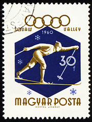 Image showing Running skier on post stamp