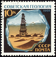 Image showing Drilling rig in desert on post stamp