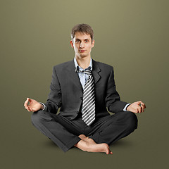 Image showing businessman in lotus pose