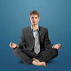 Image showing businessman in lotus pose