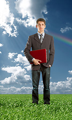 Image showing Full length portrait of businessman with laptop outdoor