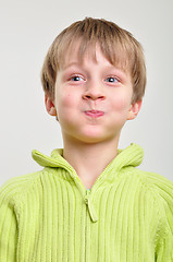 Image showing elementary boy making funny faces