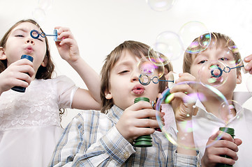 Image showing children blowing bubbles