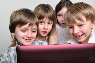 Image showing group of children friends playing computer games