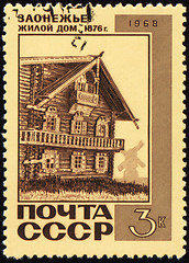 Image showing Old wooden house on post stamp