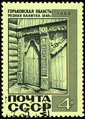 Image showing Old wooden wicket with carving on post stamp