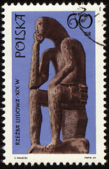 Image showing Statue of seated man on post stamp