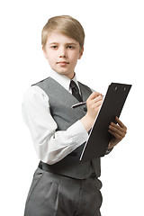 Image showing Boy  in uniform  suit with clipboard and pen