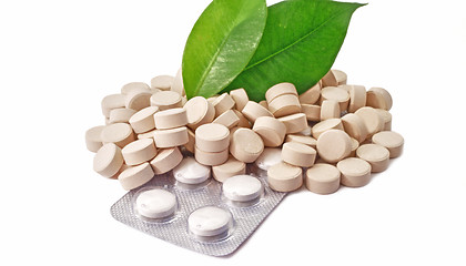 Image showing Pills tablets medicine bio with green leaf