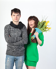 Image showing happy young couple with bouquet flowers