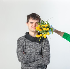 Image showing Young man gets hit in the face bunch