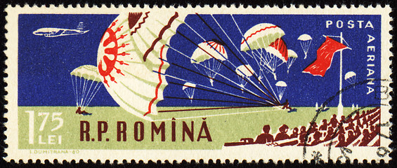 Image showing Parachutists landing in stadium  on post stamp