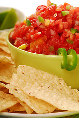 Image showing Tortilla chips with salsa and lime