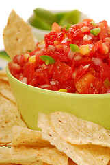 Image showing Tortilla chips with salsa and lime