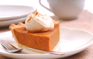 Image showing Slice of pumpkin pie with whipped cream