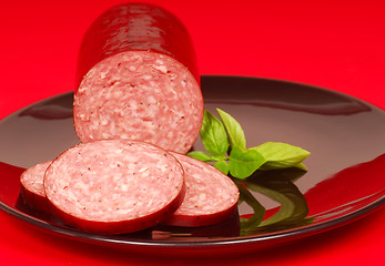 Image showing Cured salami with basil
