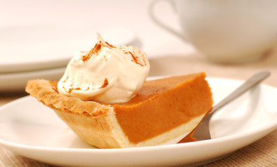 Image showing Slice of pumpkin pie with whipped cream