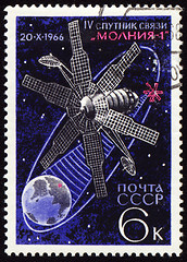 Image showing Postage stamp with communication satellite in space