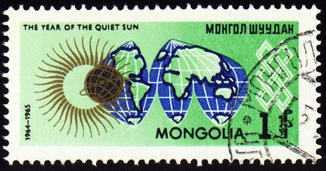 Image showing Post stamp with map Globe and symbol of the Sun