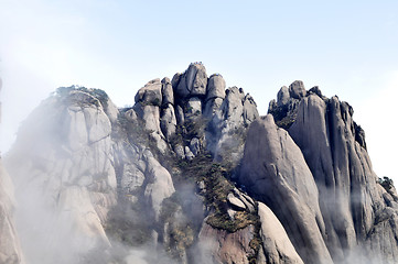 Image showing Rocky mountains in the morning fogs