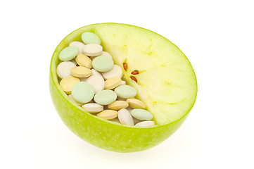 Image showing Close up of apple and pills isolated 