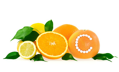 Image showing Orange, lemon, grapefruit with vitamin c pills over white background 