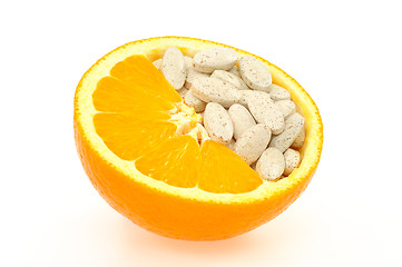 Image showing Close up of orange and pills isolated 