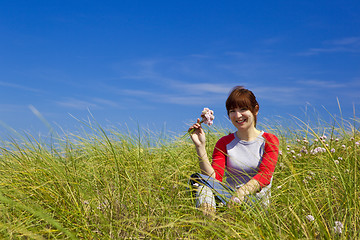 Image showing Woman with flowers