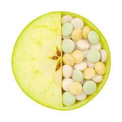 Image showing Close up of apple and pills isolated