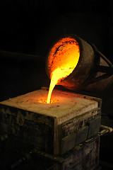 Image showing Foundry - molten metal poured from ladle into mould - lost wax casting