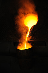 Image showing Foundry - molten metal poured from ladle for casting