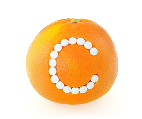 Image showing Grapefruit with vitamin c pills over white background