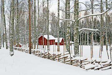 Image showing Red wooden houses in a snowy landscape