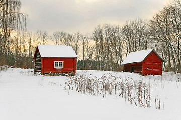 Image showing Old red houses in a winter landscape