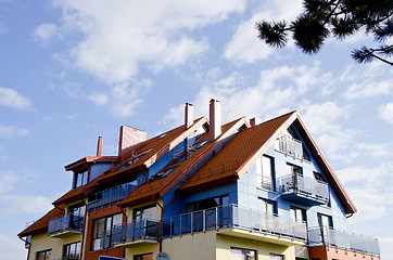 Image showing Modernist architecture building sunlit cloudy sky 