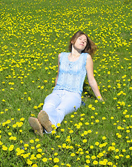 Image showing Girl on dandelion lawn