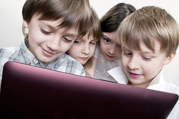 Image showing group of children friends playing computer games