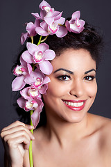 Image showing Pretty Woman with Orchid Flower