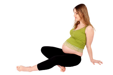 Image showing Pregnant Woman Sitting on the Ground