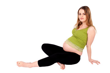 Image showing Pregnant Woman Sitting on the Ground