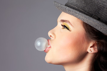 Image showing Girl Making a Bubble Side View Portrait