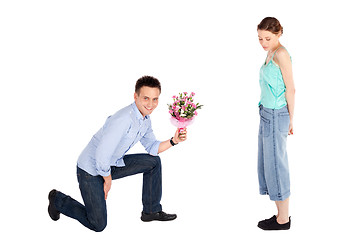 Image showing Casual Man Offering Flowers to Woman