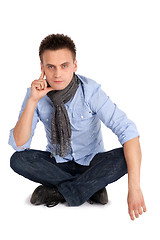 Image showing Thoughtful Man Sitting with Legs Crossed