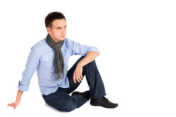 Image showing Casual Man Sitting on the ground