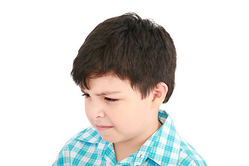 Image showing Adorable small boy looking at the viewer in a pensive mood. 