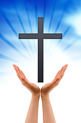 Image showing Hand holding a Cross