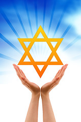 Image showing Hand holding a Jewish Star 