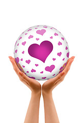 Image showing Hands holding a Love Sphere