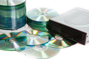 Image showing compact discs and burner on a white background 