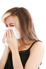 Image showing Closeup of gorgeous caucasian woman with cold sneezing into tiss